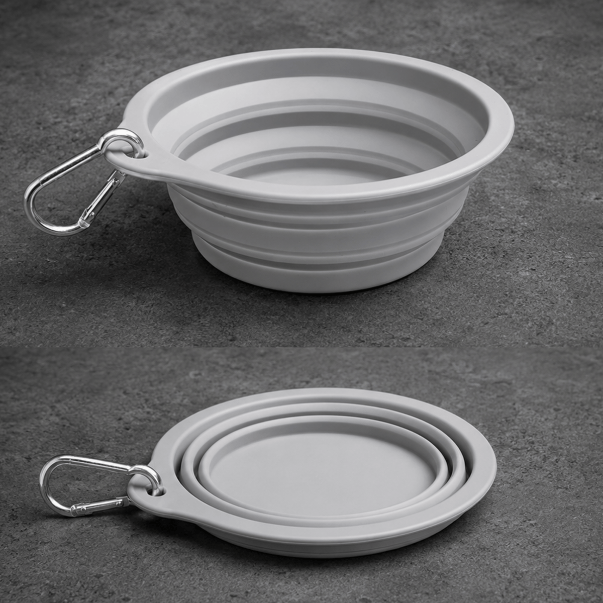 Collapsible gray dog bowl with carabiner on a dark surface